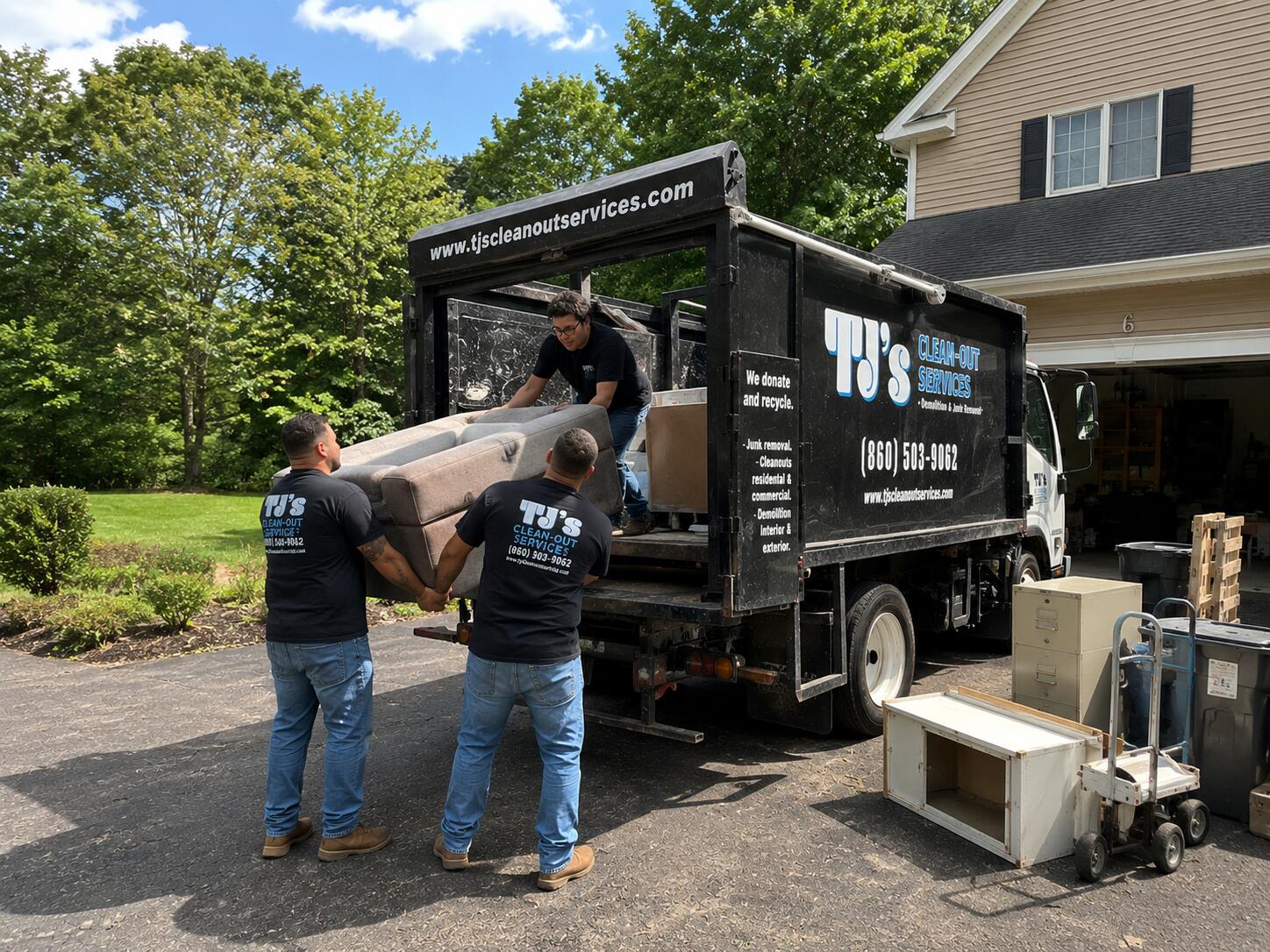 TJ's Cleanout Services junk removal crew hauling items