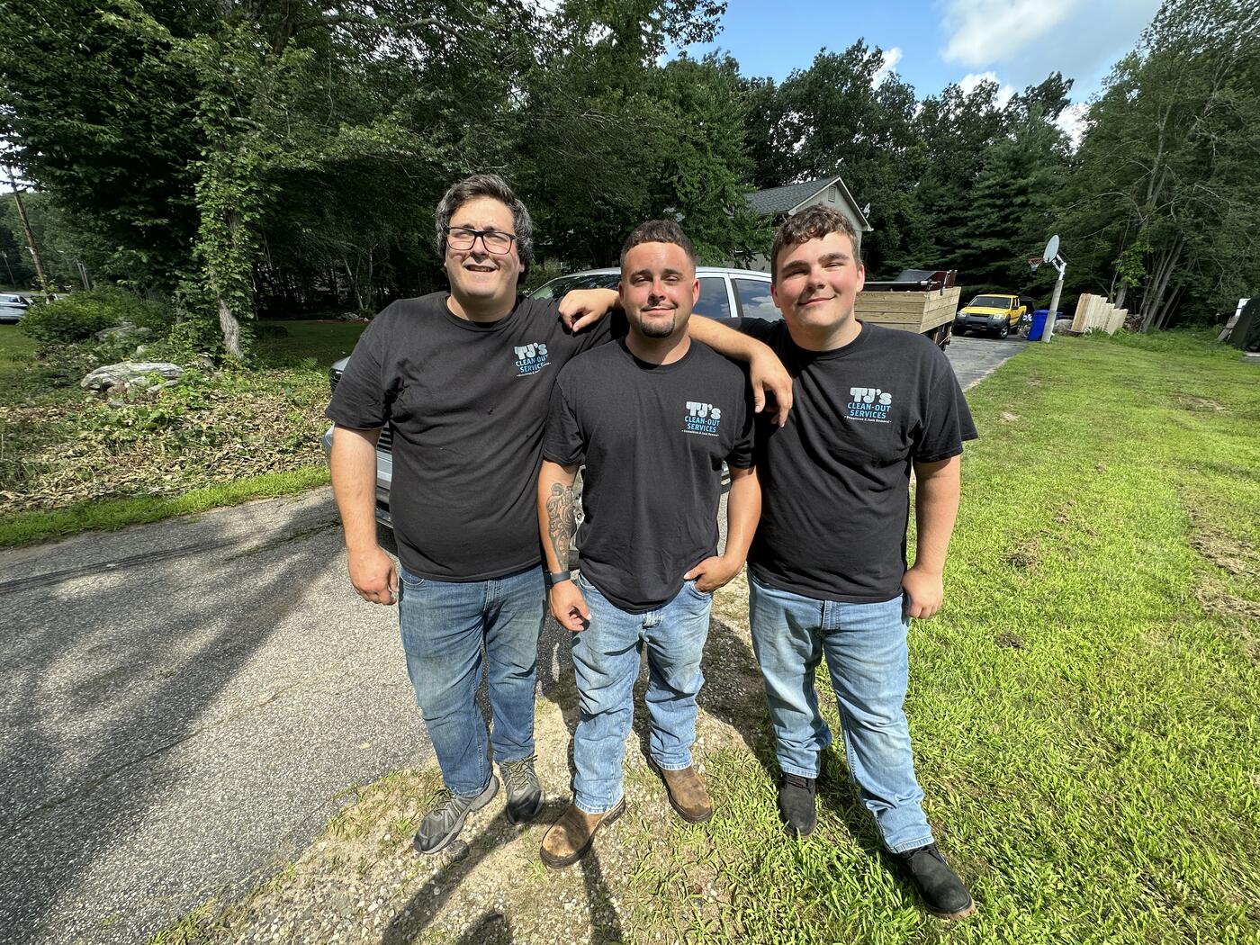 TJ's Cleanout Services junk removal crew hauling items